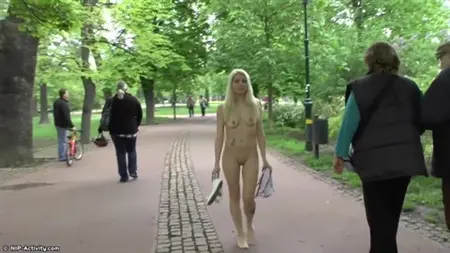 Czech chick with small tits walks naked in the park