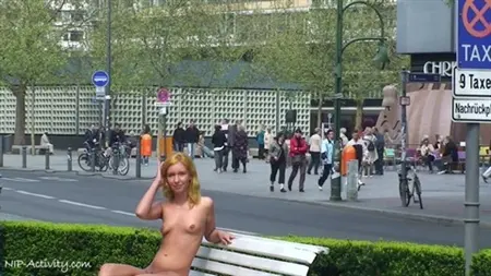 The girl publicly undressed among the park