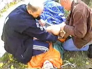 The girl was tied up and harshly fucked in the forest two men