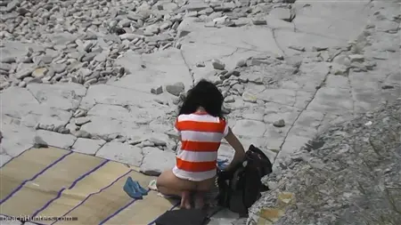 The pervert is spying on the girls on the nudist beach