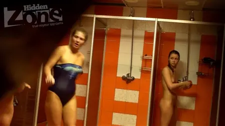 Cute cleaning lady washes the floor around while the girls take a shower