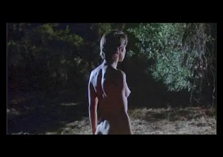 Naked Nastasya Kinski walks through the night forest in the film 