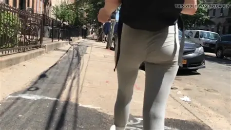 The guy follows the street behind the girl and secretly takes off her cool ass
