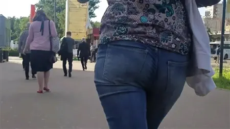 Hidden video surveillance behind the ass of a stranger in tight jeans