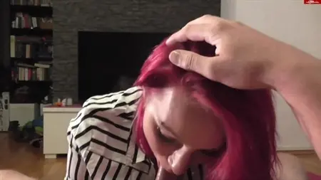 A bitch with red hair practices a throat blowjob