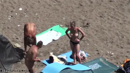Avid nudists enjoy a vacation on their favorite wild beach